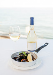 Dish from mussels against the background of the sea