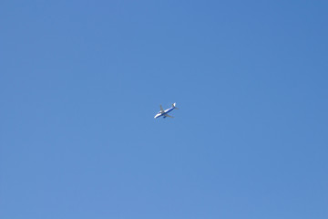 Airplane on blue sky,Passenger Airplane flying in the blue sky to the resort