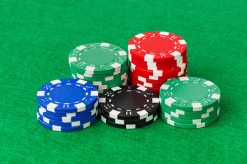 Casino chips on green table