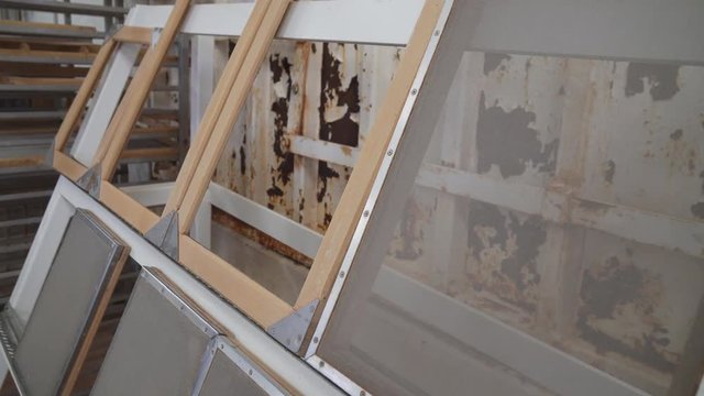 Clean and new paper deckle frames mounted up ready to be used in a paper making workshop.