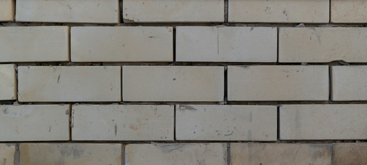Wall from a white brick for design and texture