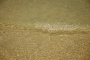 Small waves lapped the beach
