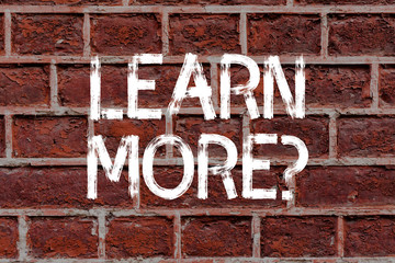 Text sign showing Learn More question. Business photo text gain knowledge or skill studying practicing Brick Wall art like Graffiti motivational call written on the wall
