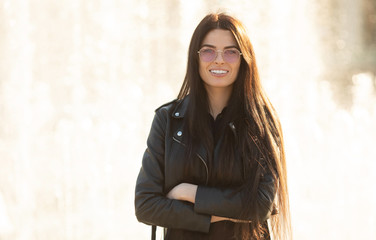 Outdoors portrait of beautiful young girl laughing