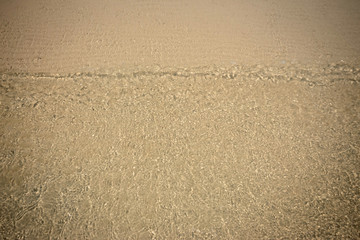 Small waves lapped the beach
