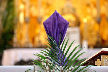 Covered cross by purple cloth on the altar in Lent Season and Holy Week