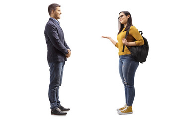Young man talking with a female student gesturing with hand