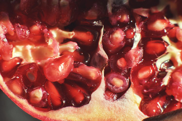 pomegranate seeds close-up. pomegranate on a dark background