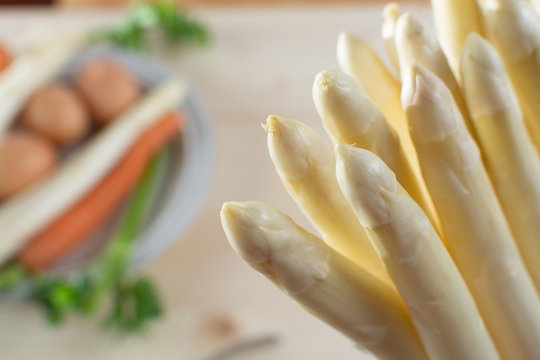 New harvest of white asparagus, high quality raw asparagus, carrot and selery in spring season, ready to cook