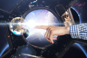 persons hand touch water bubble in the space craft, elements of this image furnished by nasa b