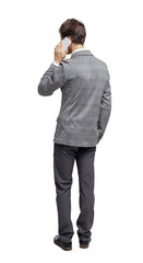  back view of business man in suit  talking on mobile phone.