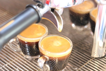 Black coffee being brewed by the machine