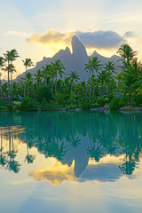 View of the Mont Otemanu mountain reflecting in water at sunset in Bora Bora, French Polynesia, South Pacific - obrazy, fototapety, plakaty