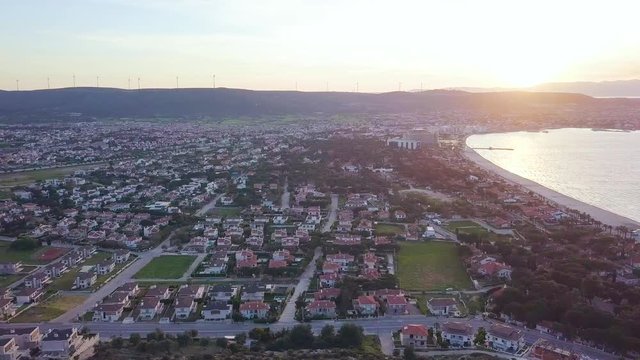 4k hd aerial drone shot, during golden hour, in a sandy beach in İzmir, Turkey