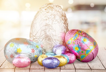 Middle group of chocolate candy Easter eggs wrapped in foil