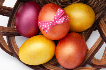 Easter eggs closeup on a wooden stand. Greeting card with Easter.