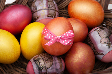 Easter eggs closeup on a wooden stand. Greeting card with Easter.