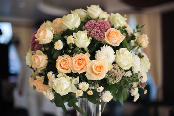 Wedding bouquet of flowers is in the vase. Delicate flowers and soft colors. Beautiful buds of lush bouquet