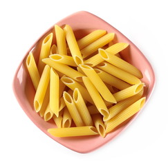 Penne rigate pasta pile in porcelain bowl isolated on white background, top view