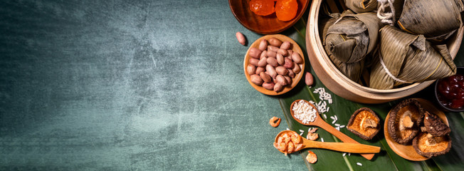 Close up, copy space, top view, flat lay. Famous asian chinese tasty handmade food in duan wu festival, steamed rice dumplings shaped like pyramidal ingredients