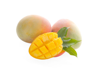 Mango fruit with mango cubes and slices. Isolated on a white background