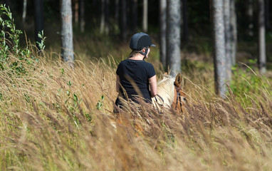 Woman horseback riding