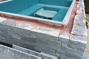 building a rock encased spa and hot tub