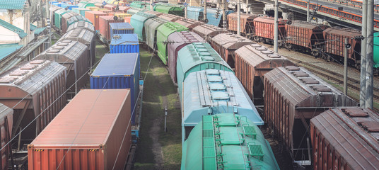 Railway wagons with cargo of metal and grain in port of Odessa. trains are waiting in line for loading at cargo terminal. most economical logistics solutions for rail transport
