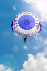 Flying in a balloon against the blue sky. Background with sunlight