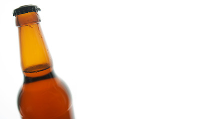 Beer bottle with water drops isolated on white background with space