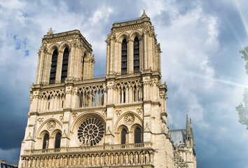 Fototapeta na wymiar Notre Dame exterior view against a cloudy sky, Paris