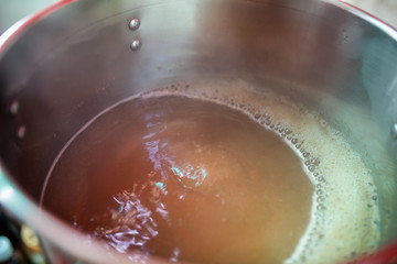Beer wort starting to boil, Wort for Home Brew Wheat Beer.