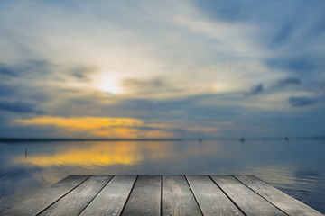 Fototapeta na wymiar Selected focus empty wooden table and view of sunset blur background with bokeh image. for your photomontage or product display. 