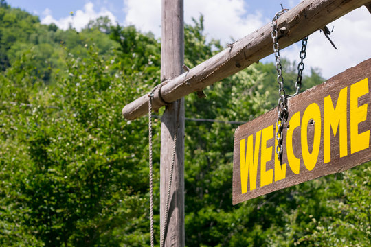 Welcome sign on wooden board 