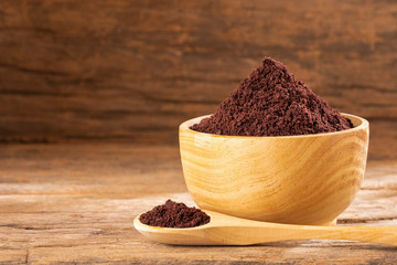 Acai berries powder - Euterpe oleracea. Wood background