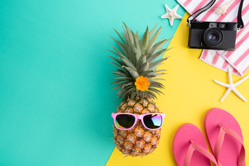 Beach accessories retro film camera, pineapple, sunglasses, flip flop starfish beach hat and sea...