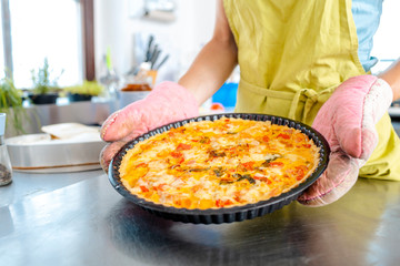 Female hand holding apple pie
