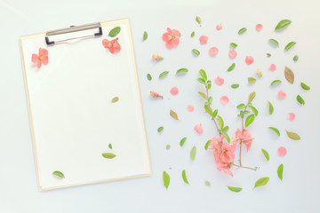 Blank paper on clipboard note pad with floral decoration