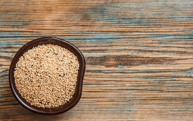 amaranth beans in bowl, on rustic wooden background