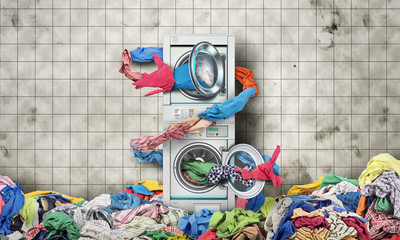 Clothes fly out of a washing machine into a tumble dryer