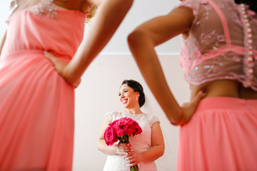 Bridesmaids and bride posing in room