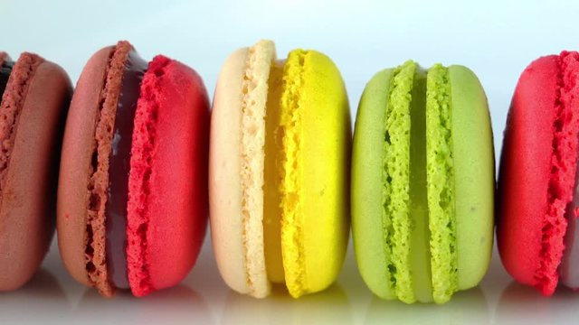 Row of multicolored Macaroons isolated on white background