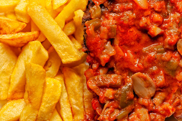 Meat in tomato sauce with french fries