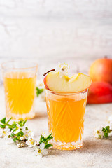 Glasses with fresh apple juice or cider