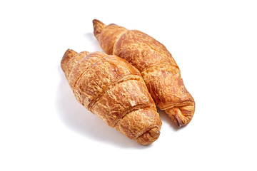 Croissants isolated on white background. Two buns. Flour baking