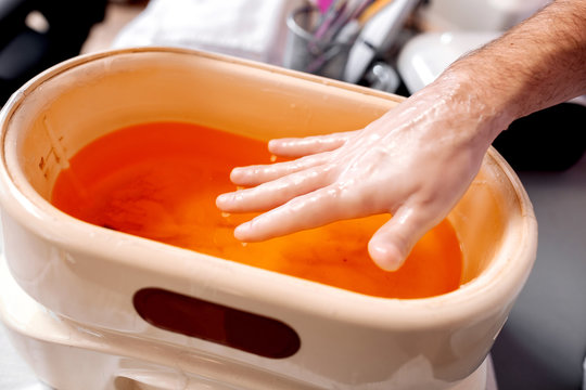 Manicure treatment with a paraffin bath tub