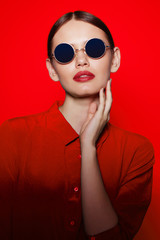 fashion model in sunglasses, beautiful young woman.