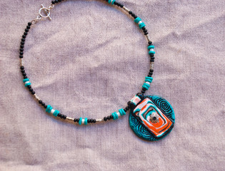 Bright tribal choker mint coral and black color. Polymer clay jewelry. Handmade design pendan.