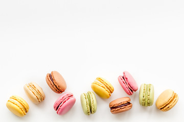 sweet dessert pattern with macarons on white background flat lay mockup