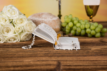 Holy communion a golden chalice with grapes and bread wafers 